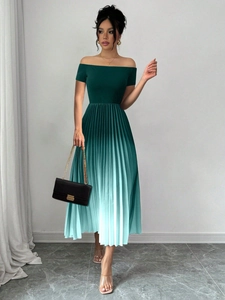 Detail of off-shoulder pleated dress showing elegant green to blue gradient effect