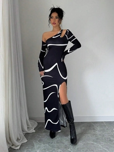 Detail view of the side slit and graffiti print on this slim fit off-shoulder dress