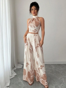 Women's summer resort two-piece set with halter neck top and tropical leaf print trousers