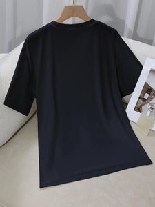 Minimalist black crew neck short sleeve t-shirt with a loose fit and premium fabric texture