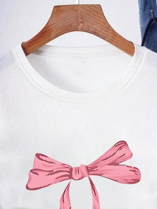 Women's white crewneck short sleeve t-shirt with a stylish pink bow print on the front