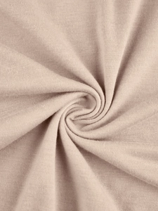 Detailed macro view of soft pink knitted cotton fabric texture with fine weave patterns
