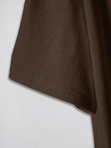 Detail of double-needle stitching and cotton texture on dark brown short-sleeved T-shirt cuff