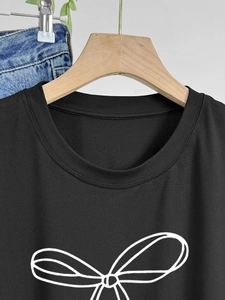 Women's black casual cotton T-shirt with minimalist white bow print and round neckline