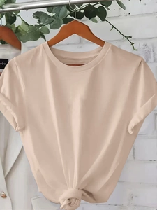 Women's apricot crew neck T-shirt featuring a stylish front knot detail on a wooden hanger