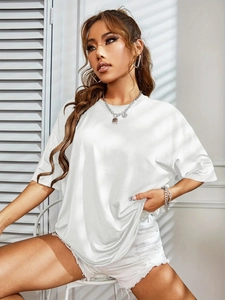 Close-up of white oversized short-sleeve T-shirt with silk-like sheen and crew neck