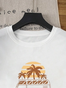 Women's white cotton crewneck T-shirt featuring a tropical palm tree and sunset print