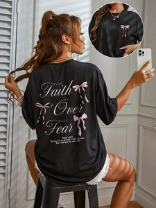 T-shirt noir pour femme avec imprimé Faith Over Fear et nœuds roses sur le dos