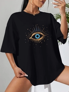 Detail of artistic evil eye print on black oversized cotton t-shirt with drop shoulder