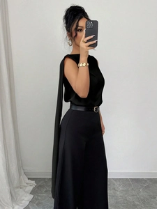 Elegant black sleeveless satin blouse with long shoulder streamer and wide-leg trousers set