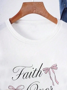 Detail of white cotton crew neck T-shirt with Faith print and pink ribbon graphic