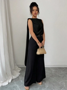 Elegant black sleeveless jumpsuit with long shoulder streamers and wide-leg trousers
