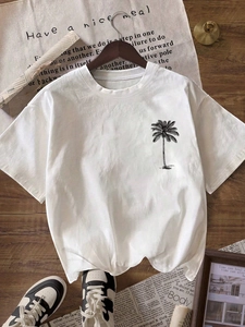 T-shirt minimalista in cotone bianco con stampa di palma nera e accessori stile vita