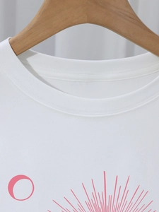 Minimalist white crew neck cotton T-shirt featuring a pink geometric graphic print