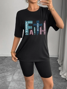 Women's black casual two-piece set featuring Faith printed T-shirt and cycling shorts