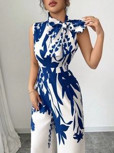 Elegant sleeveless blue and white floral print wide-leg jumpsuit with a bow necktie detail