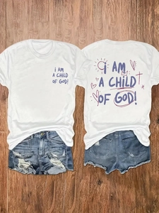 Women's white cotton t-shirt with blue denim shorts featuring 'Child of God' graphic print