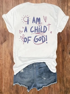 Flat lay of white cotton T-shirt with I AM A CHILD OF GOD print and denim shorts
