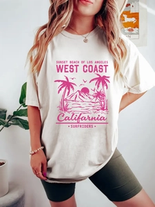 Women's oversized cream cotton t-shirt with pink Sunset Beach of Los Angeles print