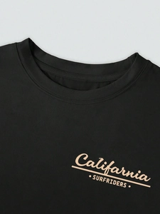 Detail of round neckline and California Surfriders print on black cotton t-shirt