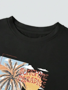 Close-up of Sunshine Paradise palm tree print on black crew neck cotton t-shirt