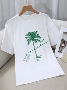 Minimalist white crew neck cotton T-shirt featuring a green palm tree print and text