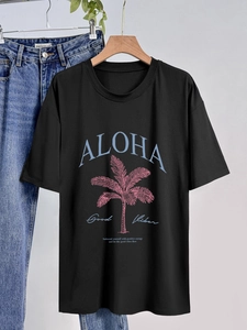 T-shirt nera oversize da donna con stampa tropicale Aloha e motivo di palme