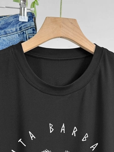 Close-up of black cotton T-shirt featuring Santa Barbara script and premium neckline