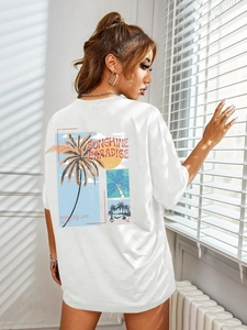Detail of white cotton T-shirt featuring a tropical palm tree sunshine paradise back print