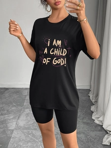 Women's black casual two-piece set with loose graphic T-shirt and cycling shorts