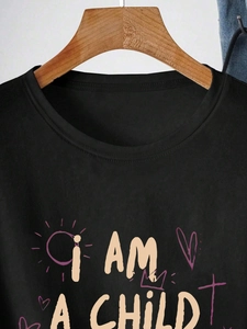 Women's black crewneck T-shirt with 'I AM A CHILD' artistic print and colorful doodle