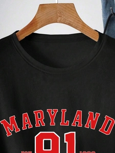 Close-up of Maryland 91 printed graphic and crew neck detail on black cotton T-shirt