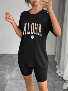 Women's black oversized T-shirt and biker shorts set with floral Aloha print