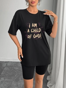 Women's black casual t-shirt and biker shorts set with colorful child of god print