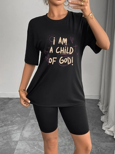 Women's black casual set with round neck t-shirt and biker shorts featuring graphic print