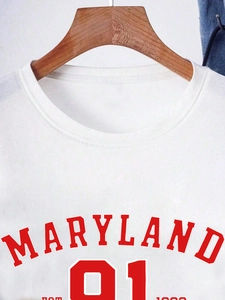 White crewneck t-shirt featuring a red Maryland 91 college style print on a wood hanger
