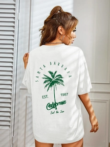 Oversized white drop shoulder T-shirt with green Santa Barbara palm tree print on back