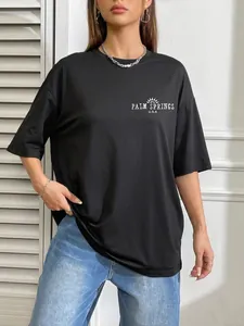 Oversized black crewneck T-shirt with white Palm Springs print and sun logo for women