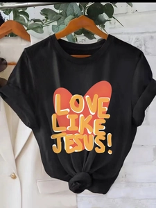 Women's black Love Like Jesus graphic tee with a heart pattern and stylish front knot detail