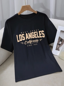 Women's black cotton T-shirt featuring vintage West Coast yellow letter print