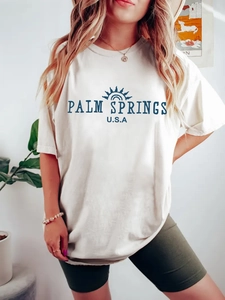 Women's white Palm Springs print T-shirt with casual round neck and loose fit design