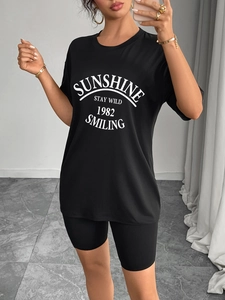 Women black oversized T-shirt and cycling shorts set with white sunshine printed text