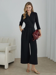 Elegant black V-neck jumpsuit with half sleeves and wide-leg trousers for a chic look