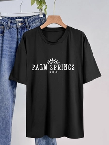 T-shirt noir minimaliste en coton avec imprimé Palm Springs blanc et col rond classique
