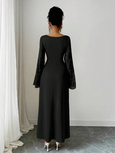 Elegant black long sleeve dress with intricate lace hollow patterns and a slim fit silhouette