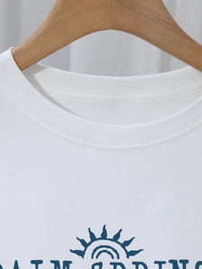 Women white round neck T-shirt with Palm Springs print and premium cotton texture