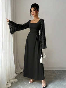 Detailed view of elegant black square neck dress with floral lace bell sleeves and ruched waist