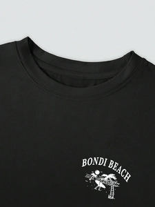 Close-up of black cotton T-shirt neckline with Bondi Beach print and fine double stitching