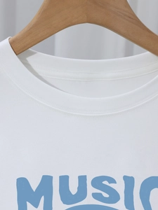Women's white cotton t-shirt featuring a blue MUSIC print and classic crew neck