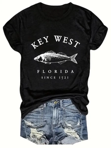 Detailed close-up of a black crewneck T-shirt featuring vintage Key West Florida fish print